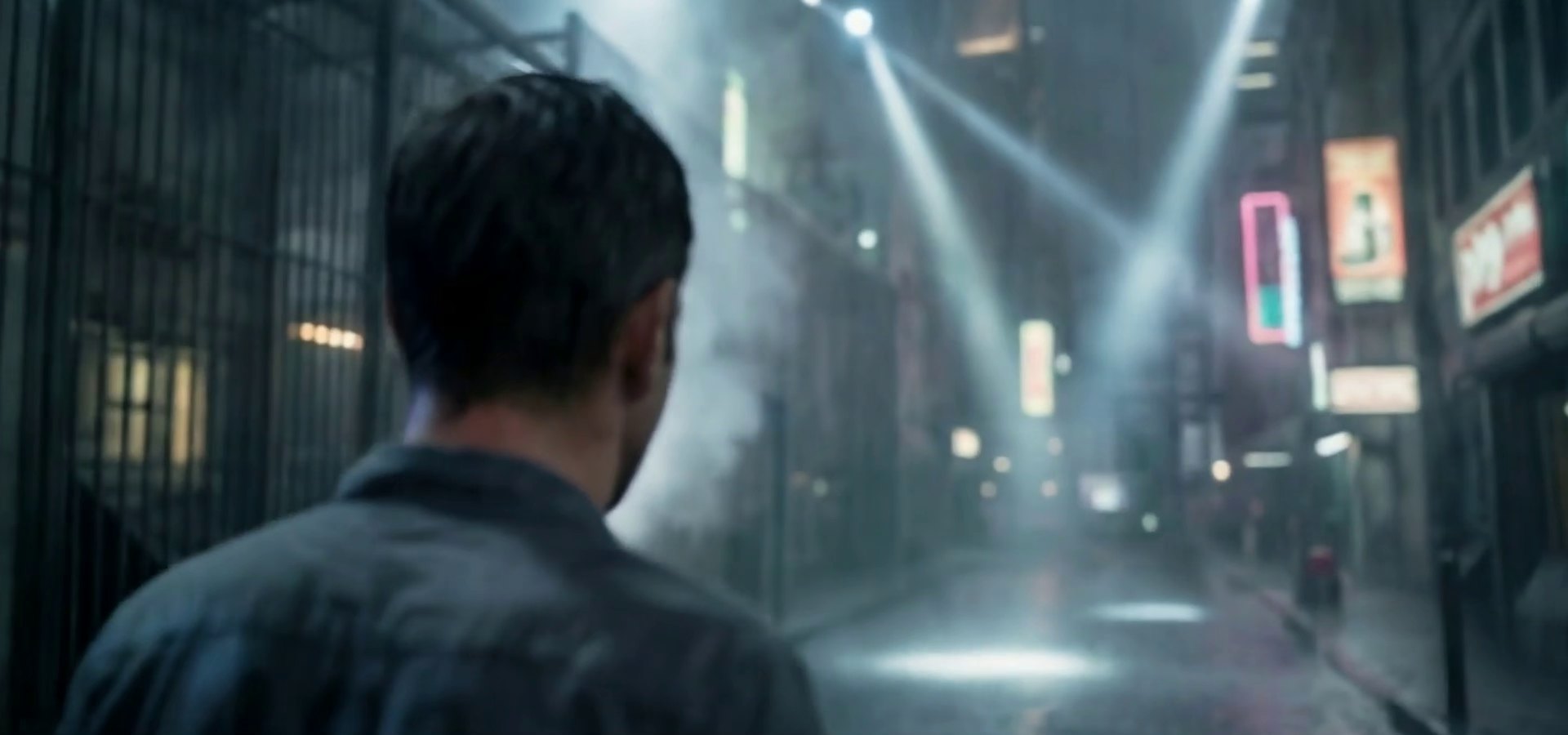 Still from The Way Home: Jack on a rain soaked city street under searchlights