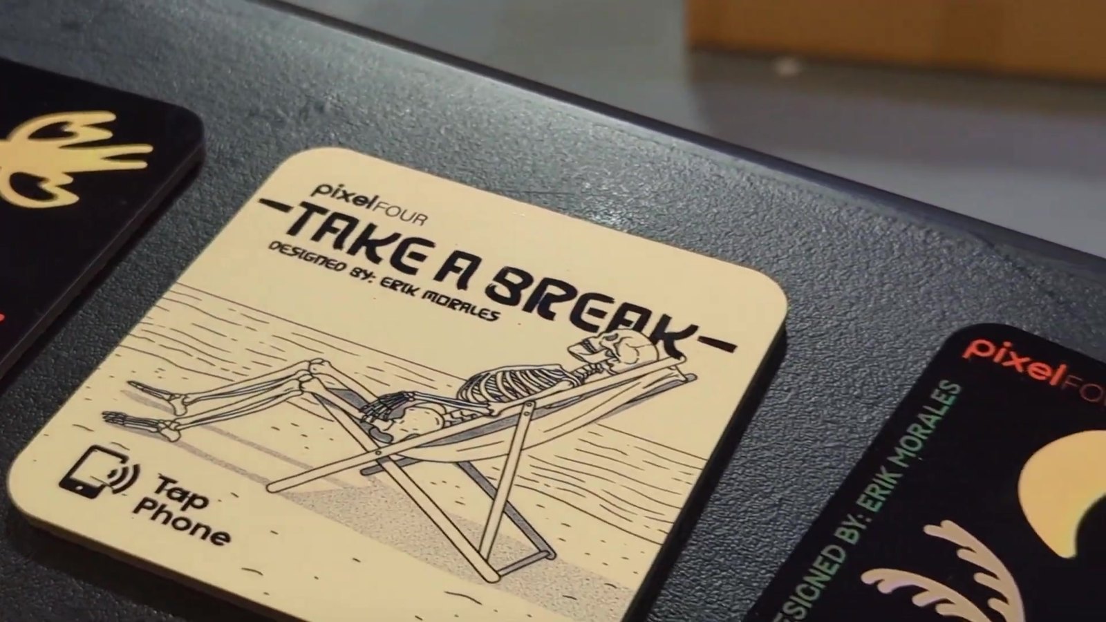 Erik’s Take a Break coaster for pixelFOUR, with a tap to phone icon