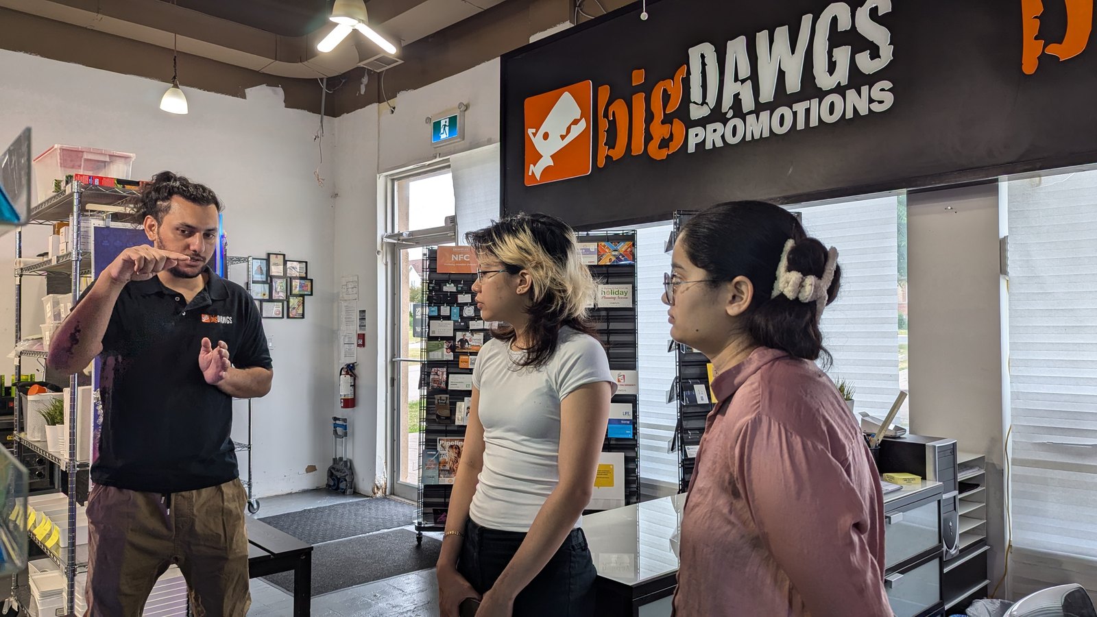 Karan briefing two interns in the bigDAWGS showroom