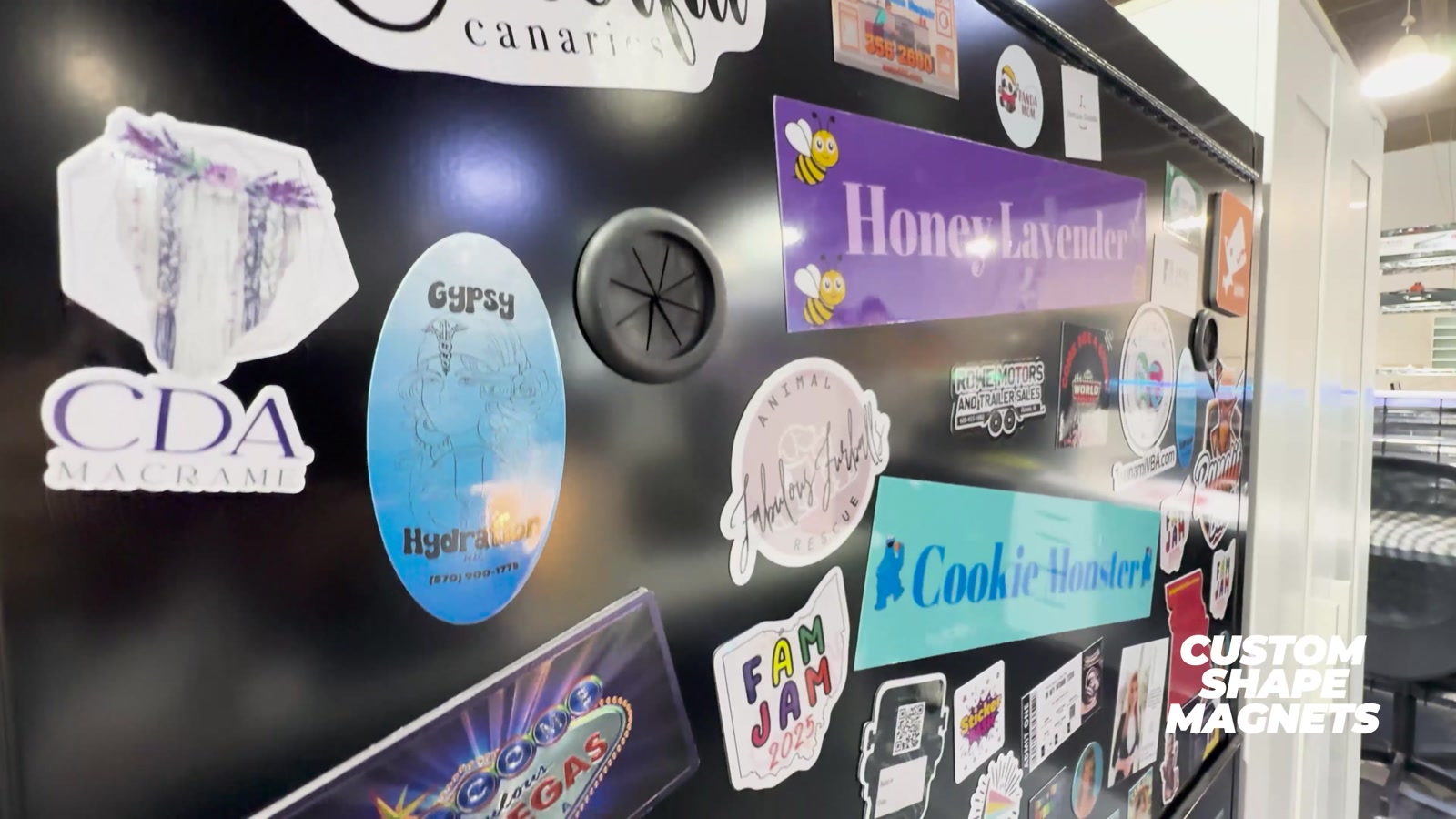 Video frame: custom shape magnets on a wall