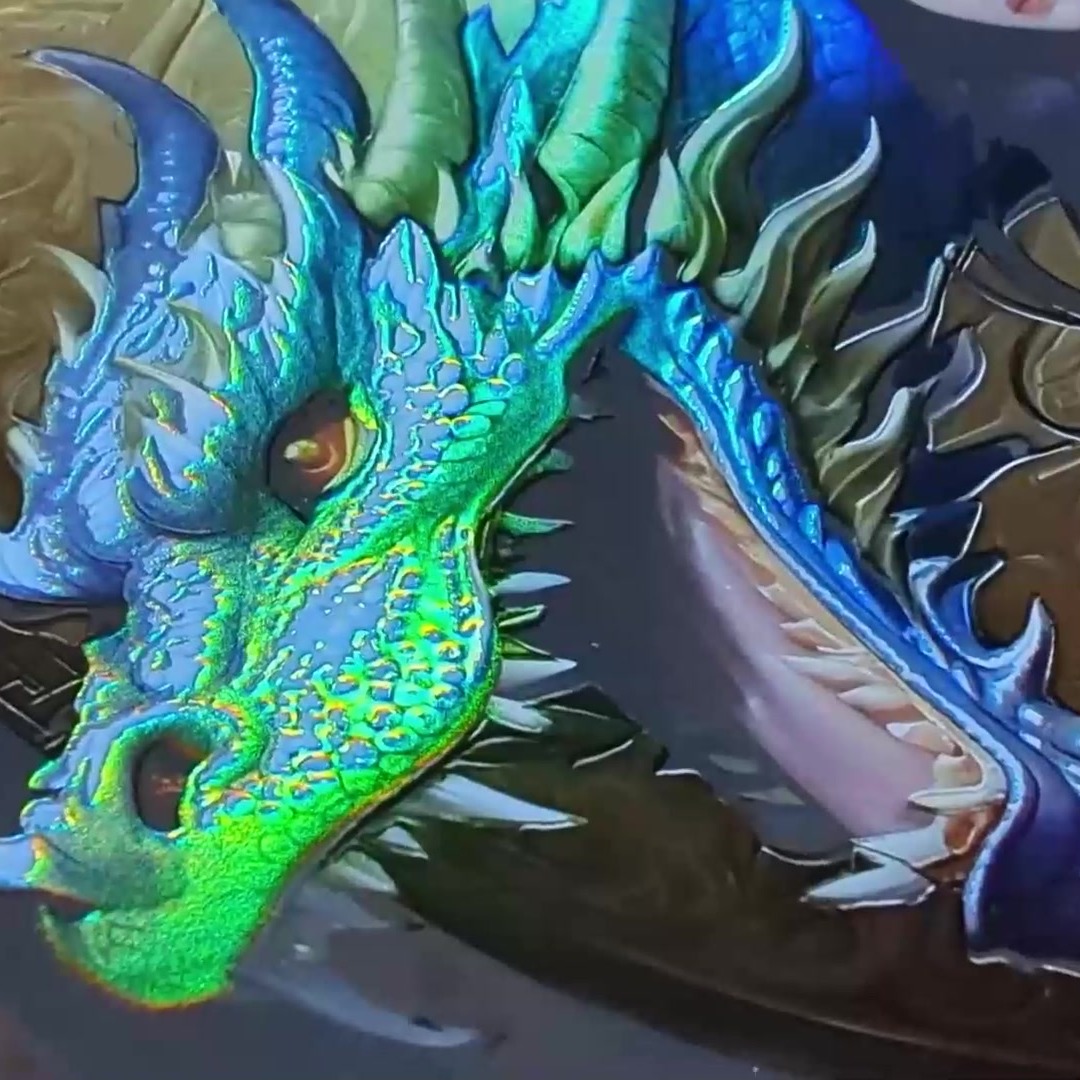 Close up of a printed blue dragon head with raised holographic scales