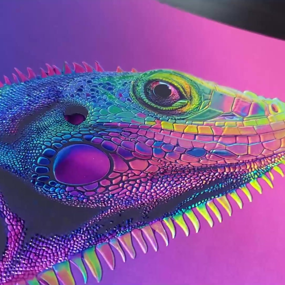 Close up of a printed lizard with raised holographic scales on a pink background