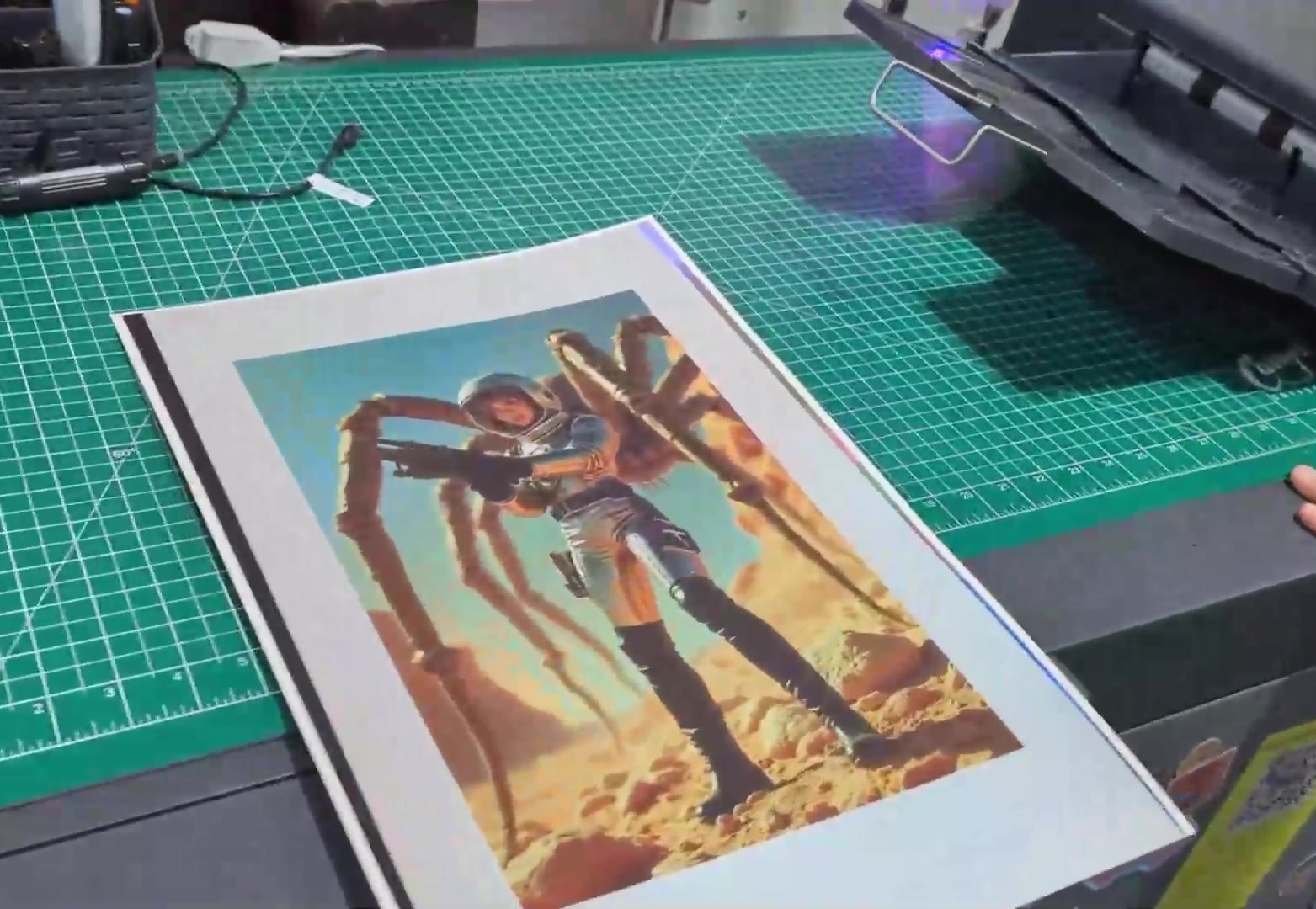 The finished sheet on a cutting mat after the second pass, printed in register over the laminated foil