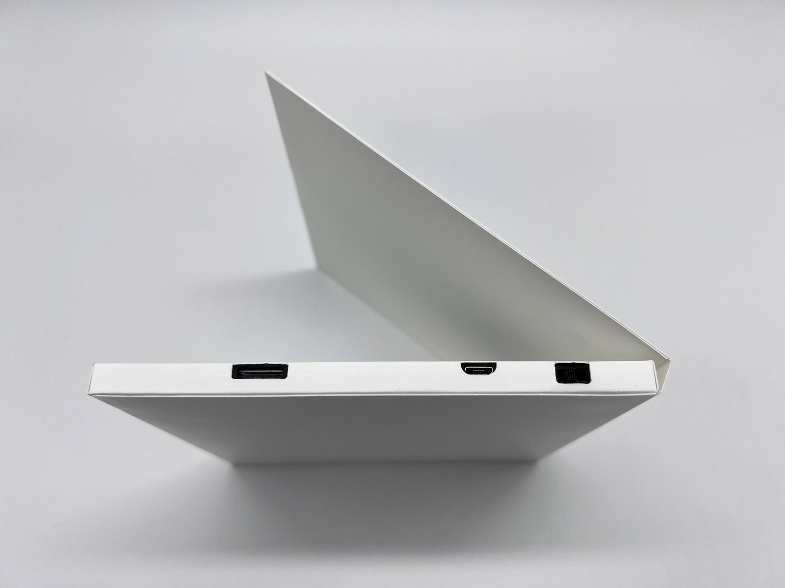 White full wrap video card from the side, with the port openings cut into the wrap